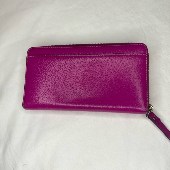 Leather Zip Around Wallet by Kate Spade in magenta.

Length: 7.75",  Height: 4" - Picture 2 of 6
